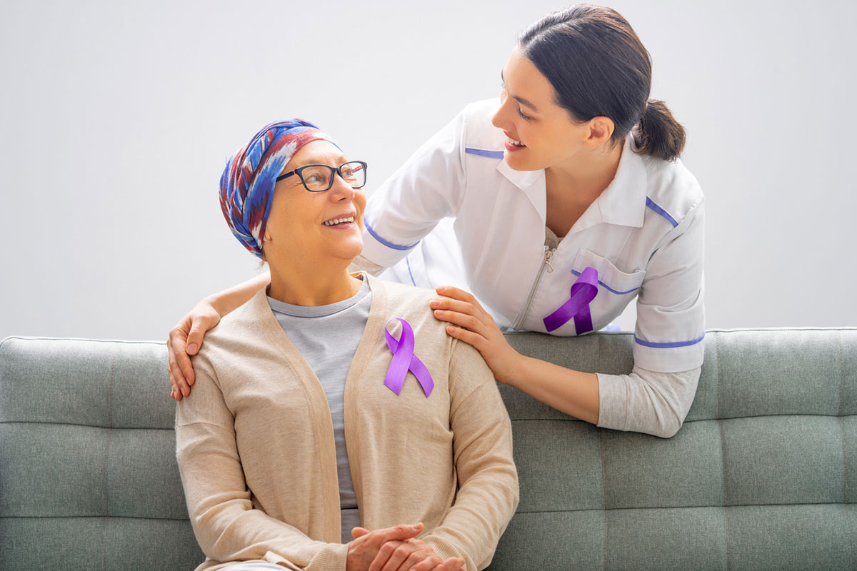 Oncology social worker smiles with patient
